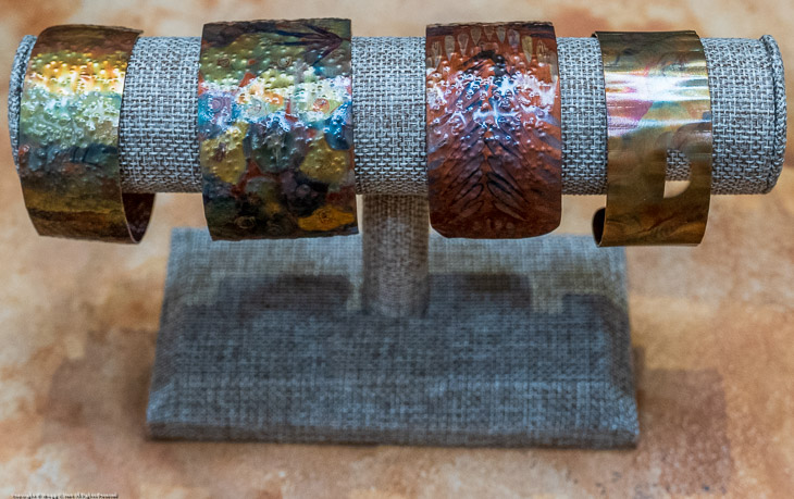 Flame-Painted Copper Wristband Display